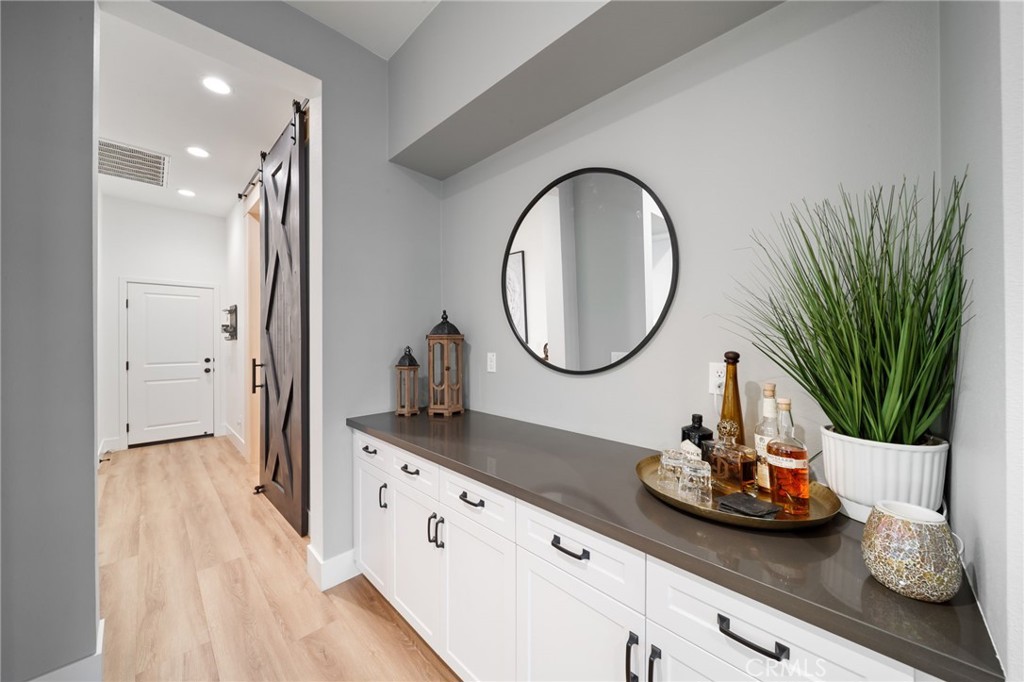 17042 Meteor Way Riverside, CA 92503 - Photo 18 of 75 a bathroom with a granite countertop sink and a mirror