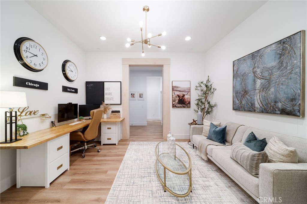 17042 Meteor Way Riverside, CA 92503 - Photo 20 of 75 a living room with furniture a clock and a chandelier