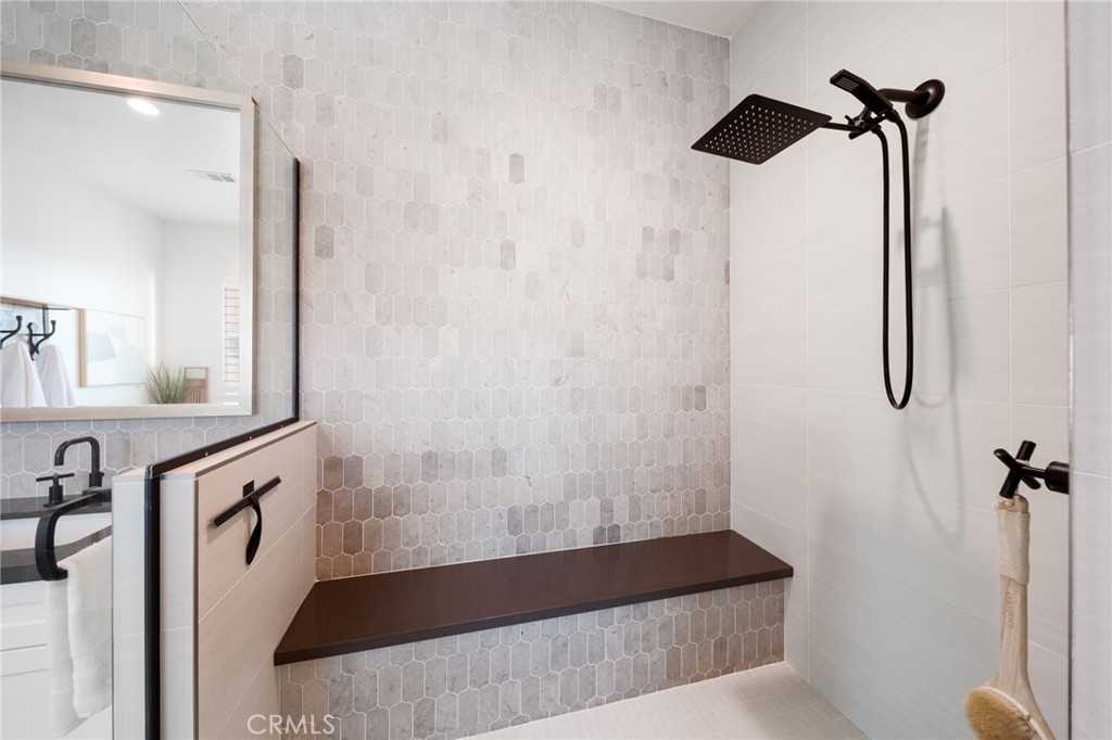 17042 Meteor Way Riverside, CA 92503 - Photo 28 of 75 a bathroom with a bathtub and a shower