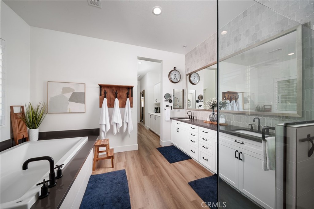 17042 Meteor Way Riverside, CA 92503 - Photo 29 of 75 a large white kitchen with a large counter top and stainless steel appliances