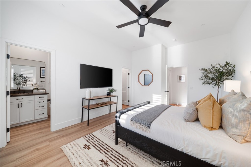 17042 Meteor Way Riverside, CA 92503 - Photo 33 of 75 a bedroom with a bed and a flat screen tv