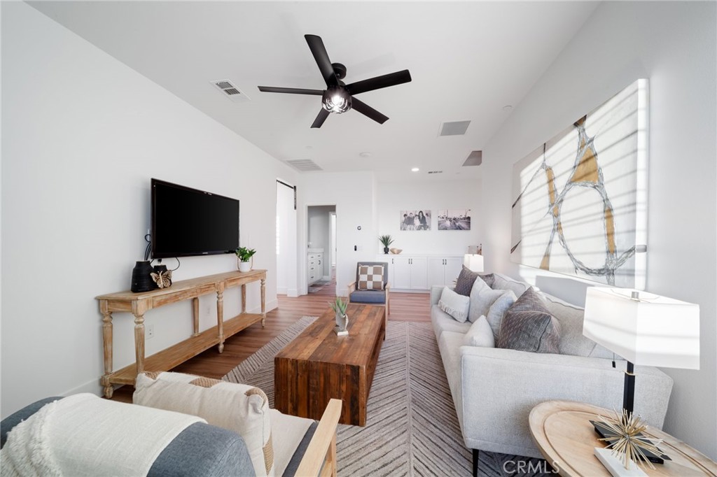 17042 Meteor Way Riverside, CA 92503 - Photo 39 of 75 a living room with furniture and a flat screen tv