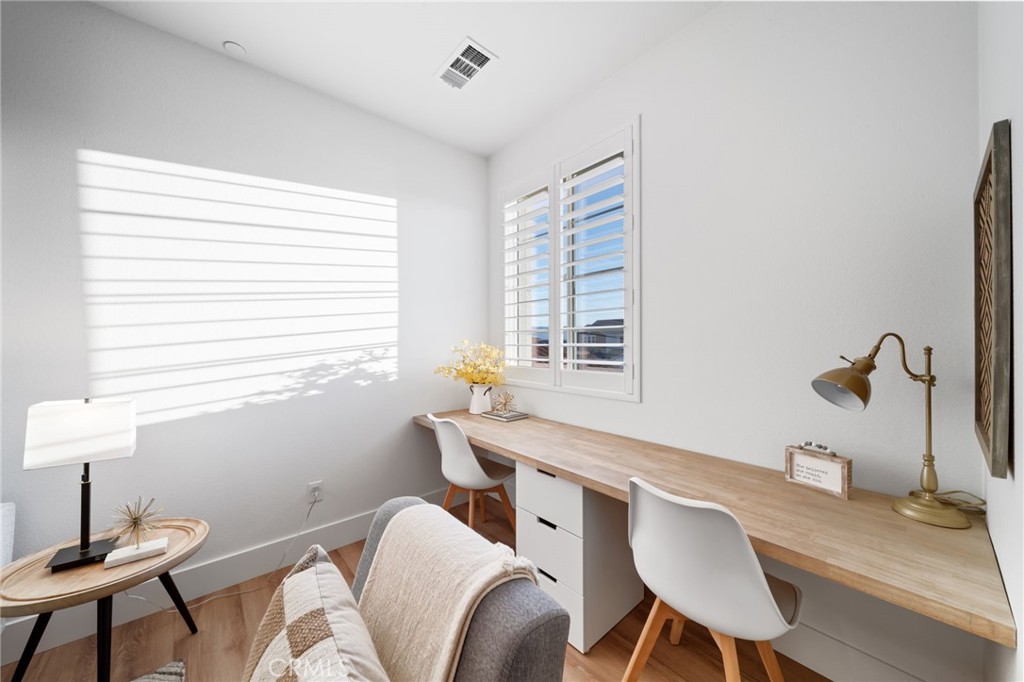17042 Meteor Way Riverside, CA 92503 - Photo 40 of 75 a view of a workspace with furniture and a window