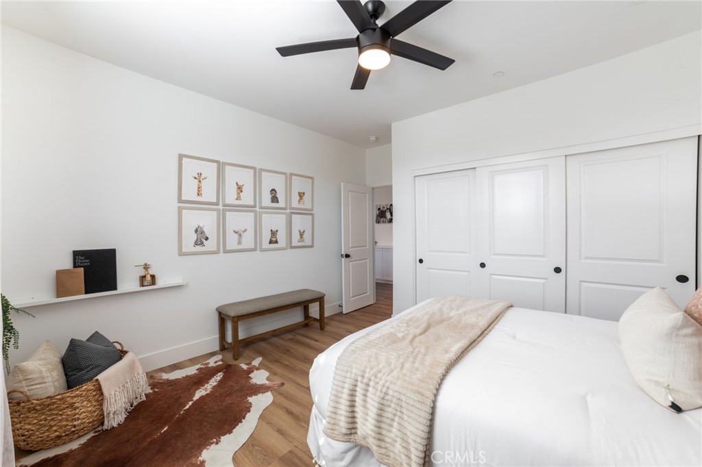17042 Meteor Way Riverside, CA 92503 - Photo 42 of 75 a spacious bedroom with a bed and a window