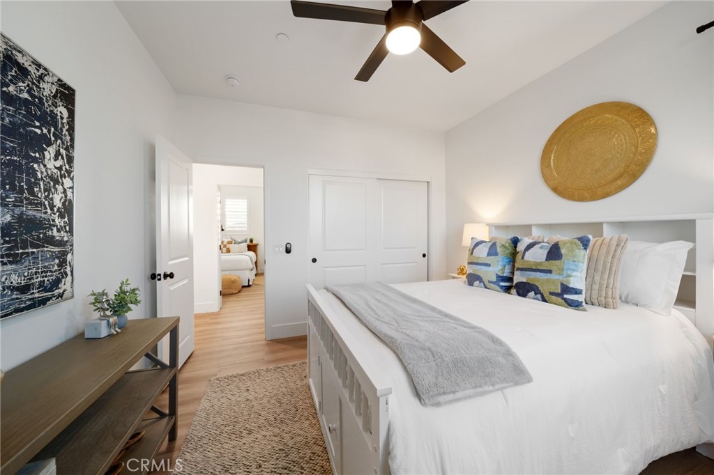 17042 Meteor Way Riverside, CA 92503 - Photo 44 of 75 a bedroom with a bed and a chandelier