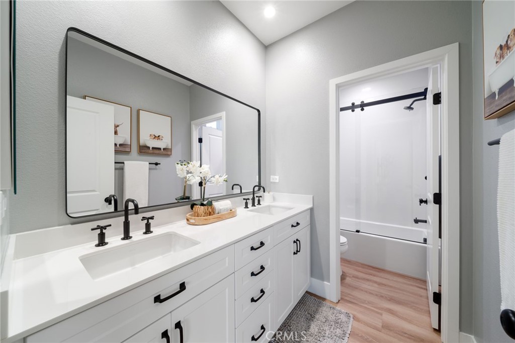 17042 Meteor Way Riverside, CA 92503 - Photo 45 of 75 a bathroom with a sink and a mirror