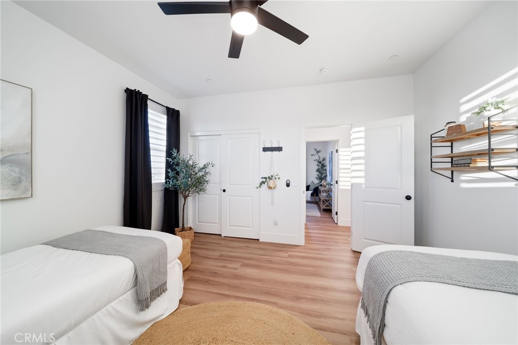 17042 Meteor Way Riverside, CA 92503 - Photo 47 of 75 a bedroom with a bed and a chandelier