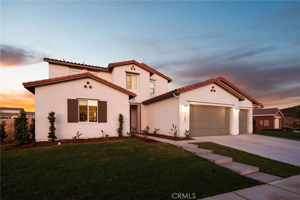 17042 Meteor Way Riverside, CA 92503 - Photo 59 of 75 a front view of a house with a yard and garage