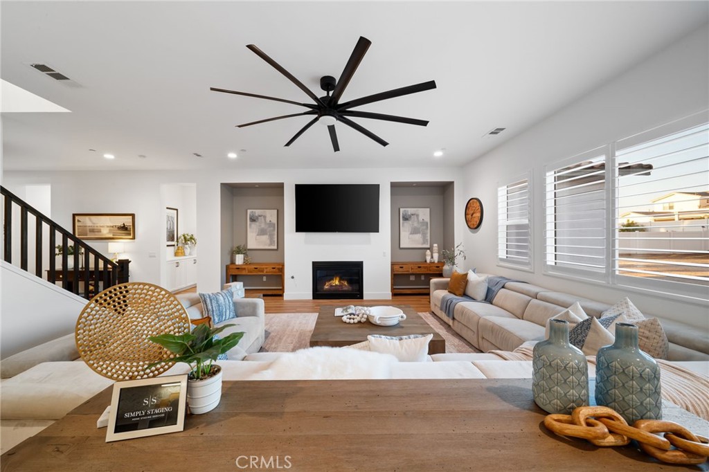 17042 Meteor Way Riverside, CA 92503 - Photo 7 of 75 a living room with furniture a fireplace and a window