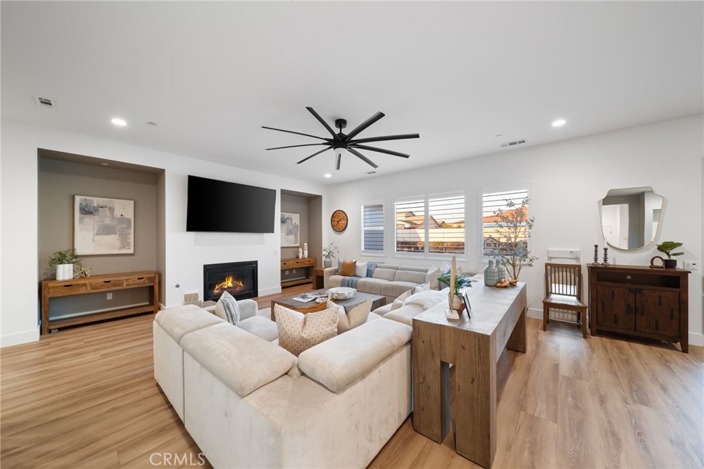 17042 Meteor Way Riverside, CA 92503 - Photo 8 of 75 a living room with furniture fireplace and a flat screen tv