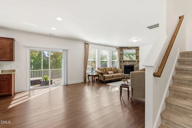 a kitchen with stainless steel appliances granite countertop a stove top oven a sink dishwasher and microwave oven