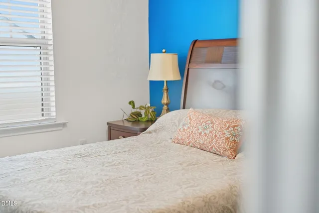 a aerial view of a house with swimming pool next to a yard
