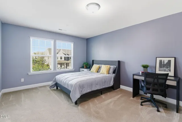 front view of a house with a tree