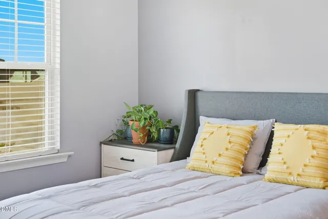 an aerial view of a house with a yard and swimming pool