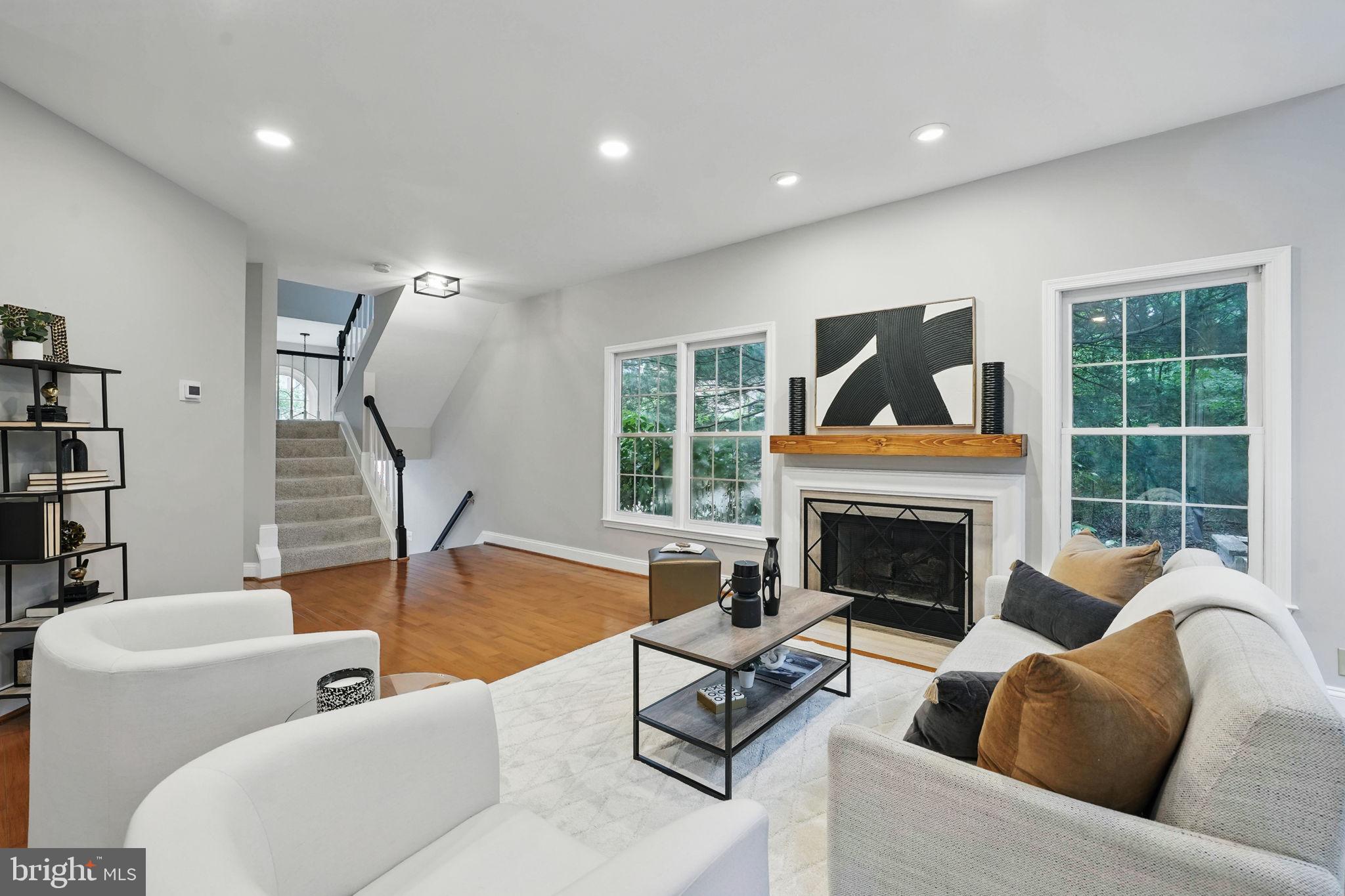 1393 Heritage Oak Way Reston, VA 20194 - Photo 13 of 80 a living room with furniture fireplace and window