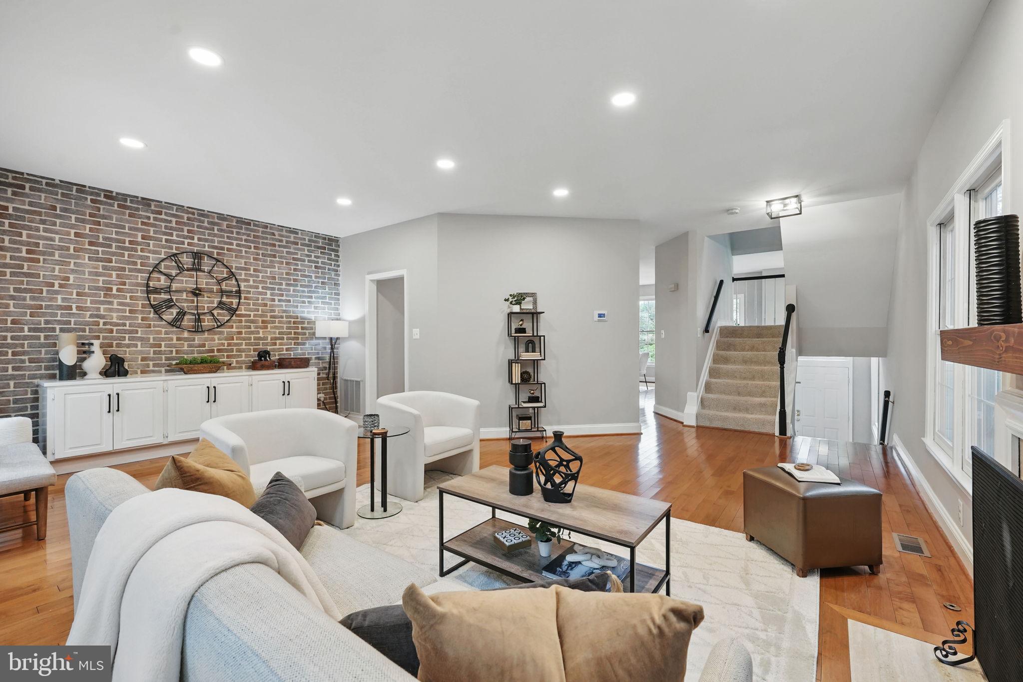 1393 Heritage Oak Way Reston, VA 20194 - Photo 14 of 80 Freshly painted, hardwoods & brick accent wall