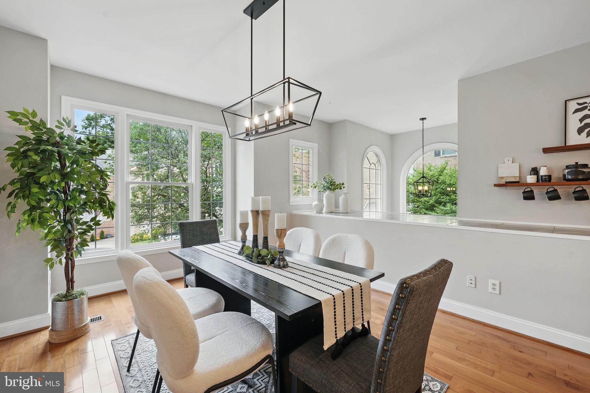 1393 Heritage Oak Way Reston, VA 20194 - Photo 17 of 80 a view of a dining room with furniture window and wooden floor