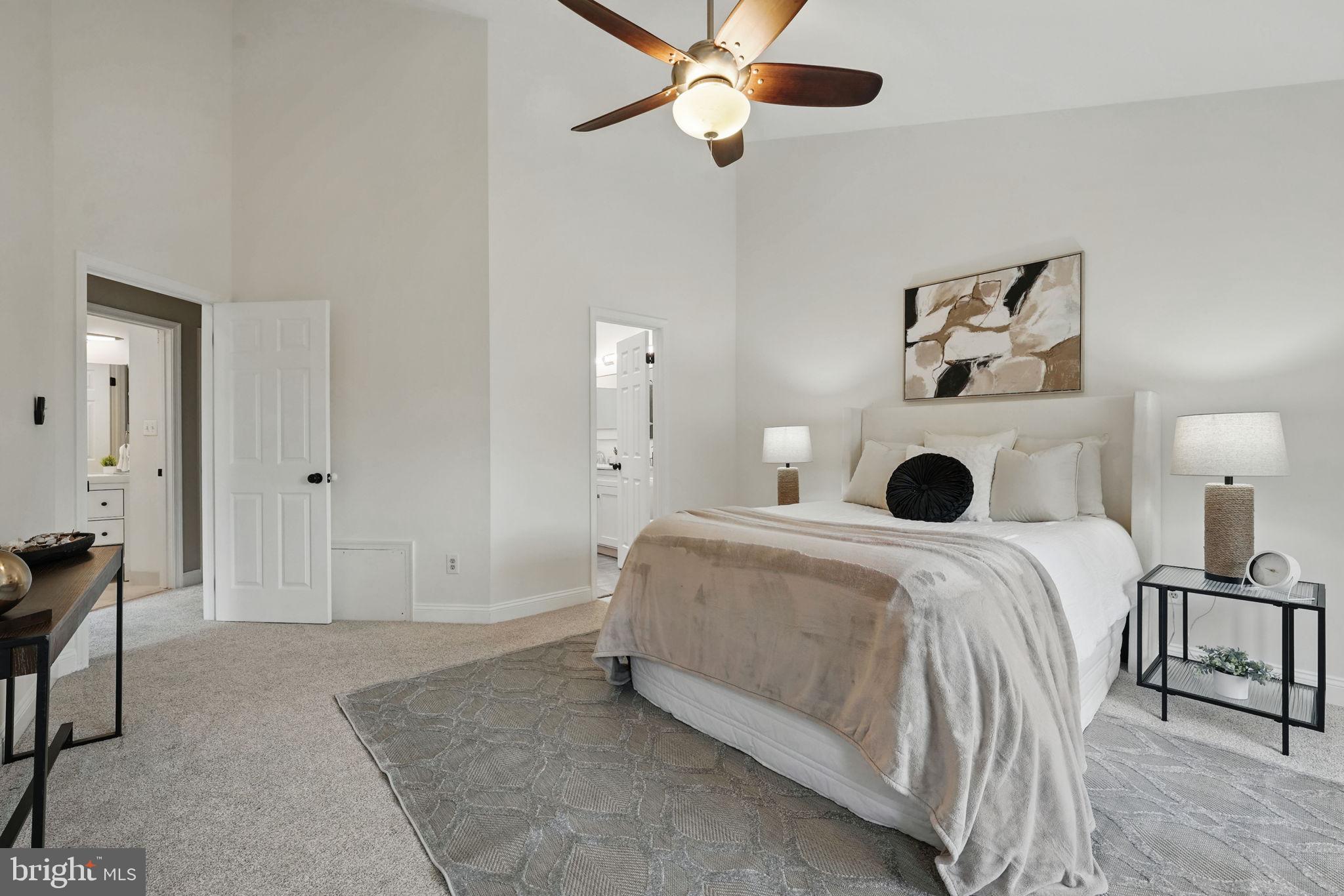 1393 Heritage Oak Way Reston, VA 20194 - Photo 27 of 80 a spacious bedroom with a bed and cabinets
