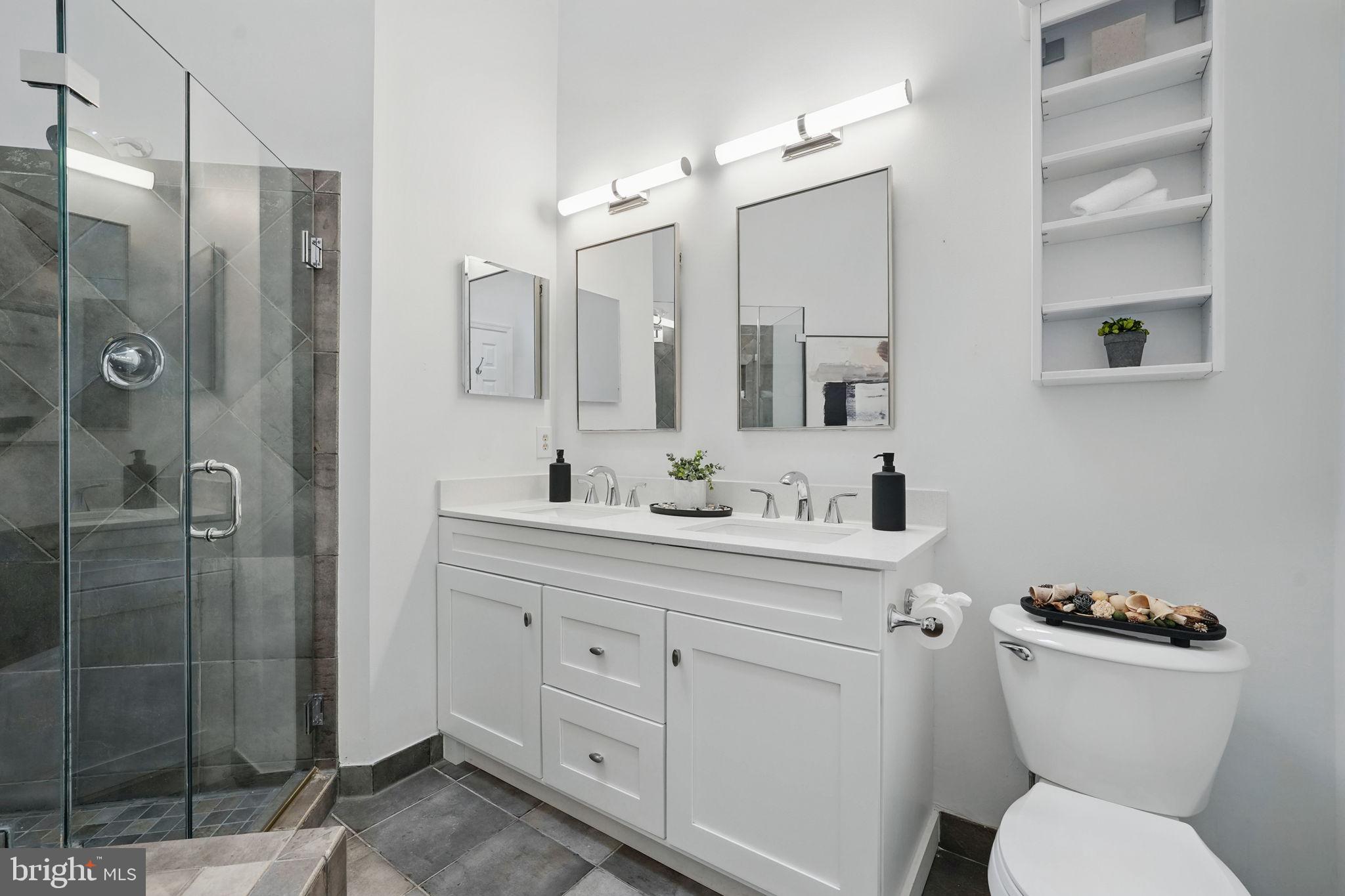 1393 Heritage Oak Way Reston, VA 20194 - Photo 28 of 80 a bathroom with a toilet sink and shower