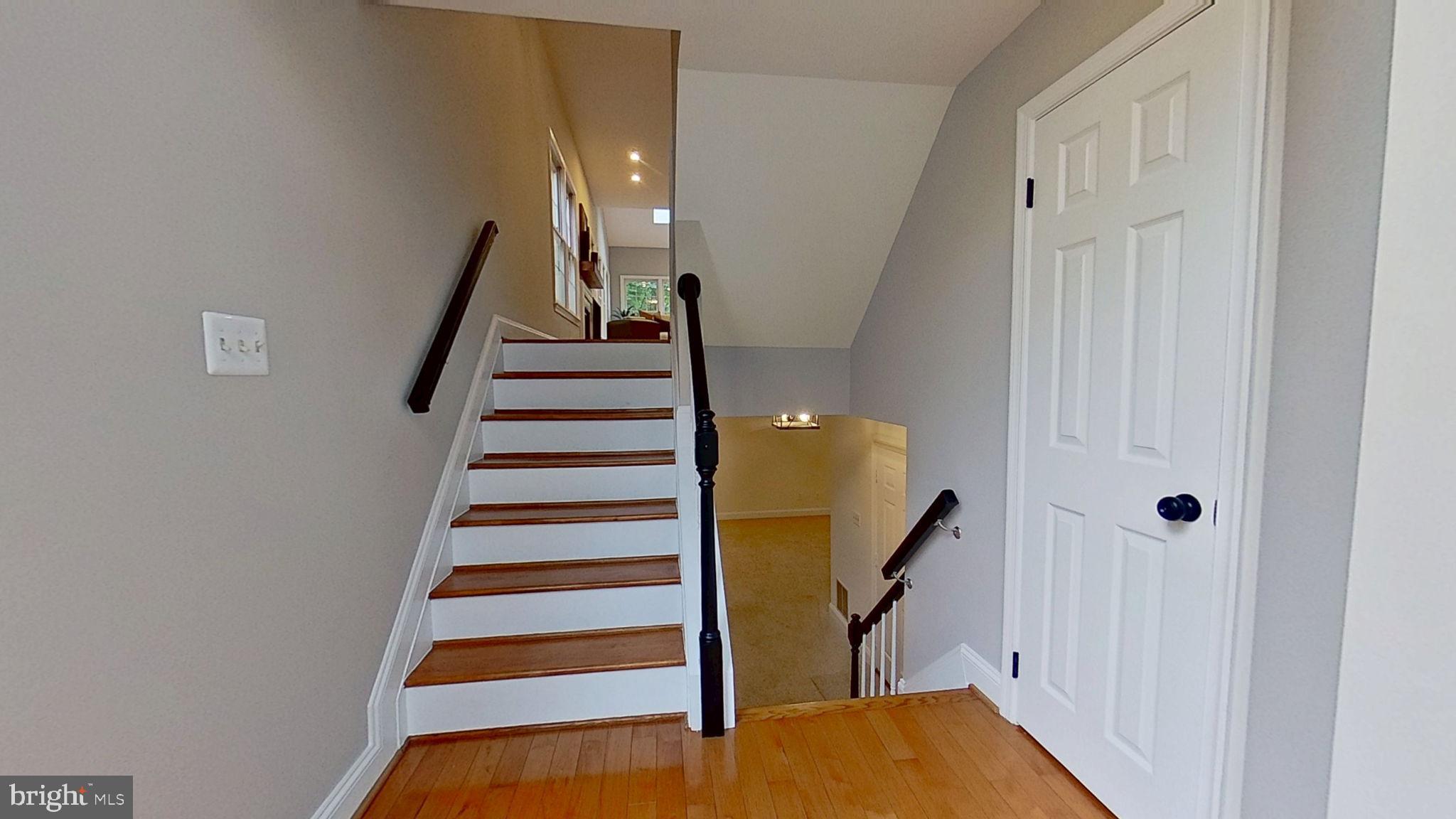 1393 Heritage Oak Way Reston, VA 20194 - Photo 37 of 80 a view of entryway with wooden floor and stairs