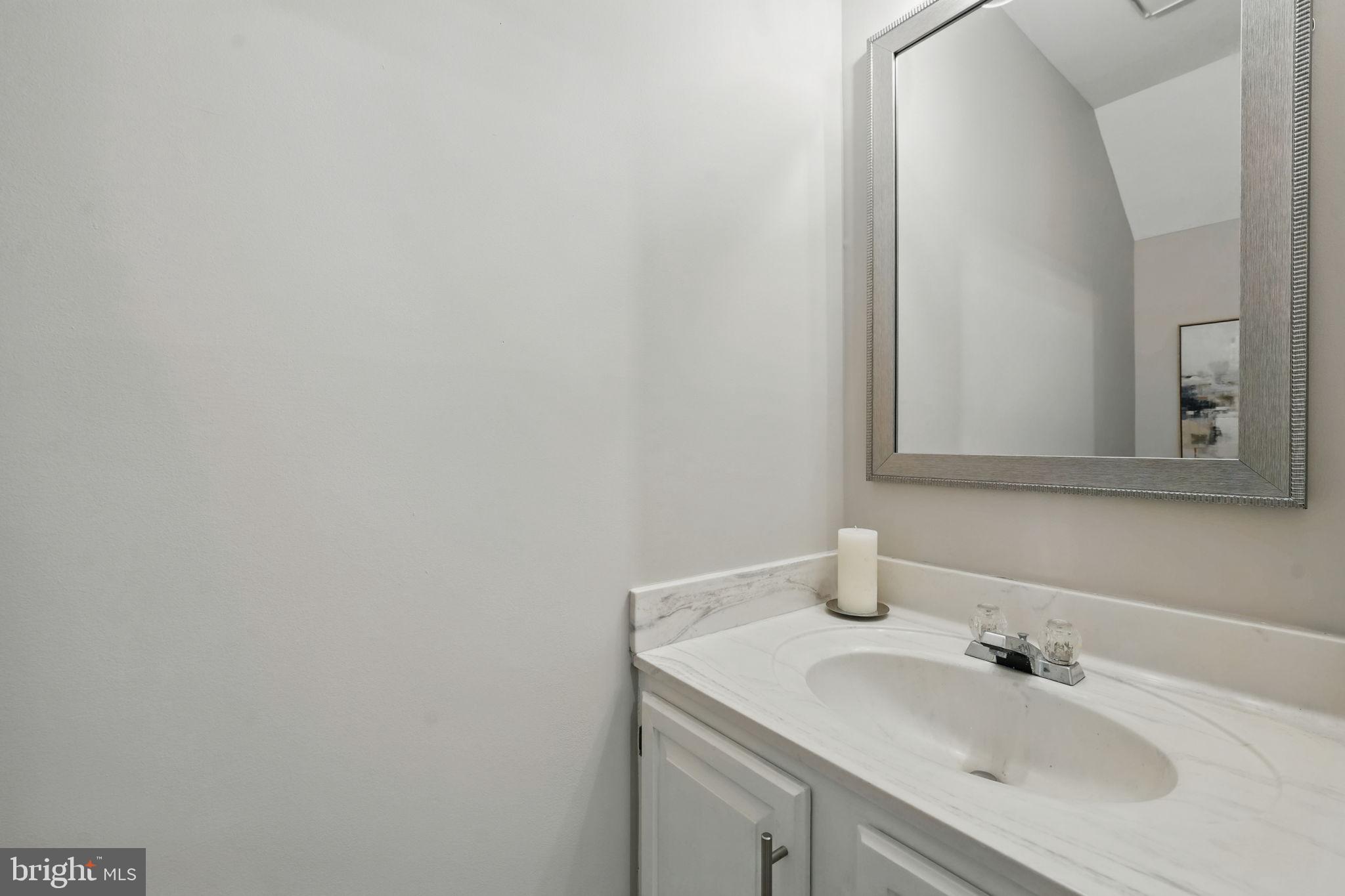 1393 Heritage Oak Way Reston, VA 20194 - Photo 38 of 80 a bathroom with a sink and a mirror