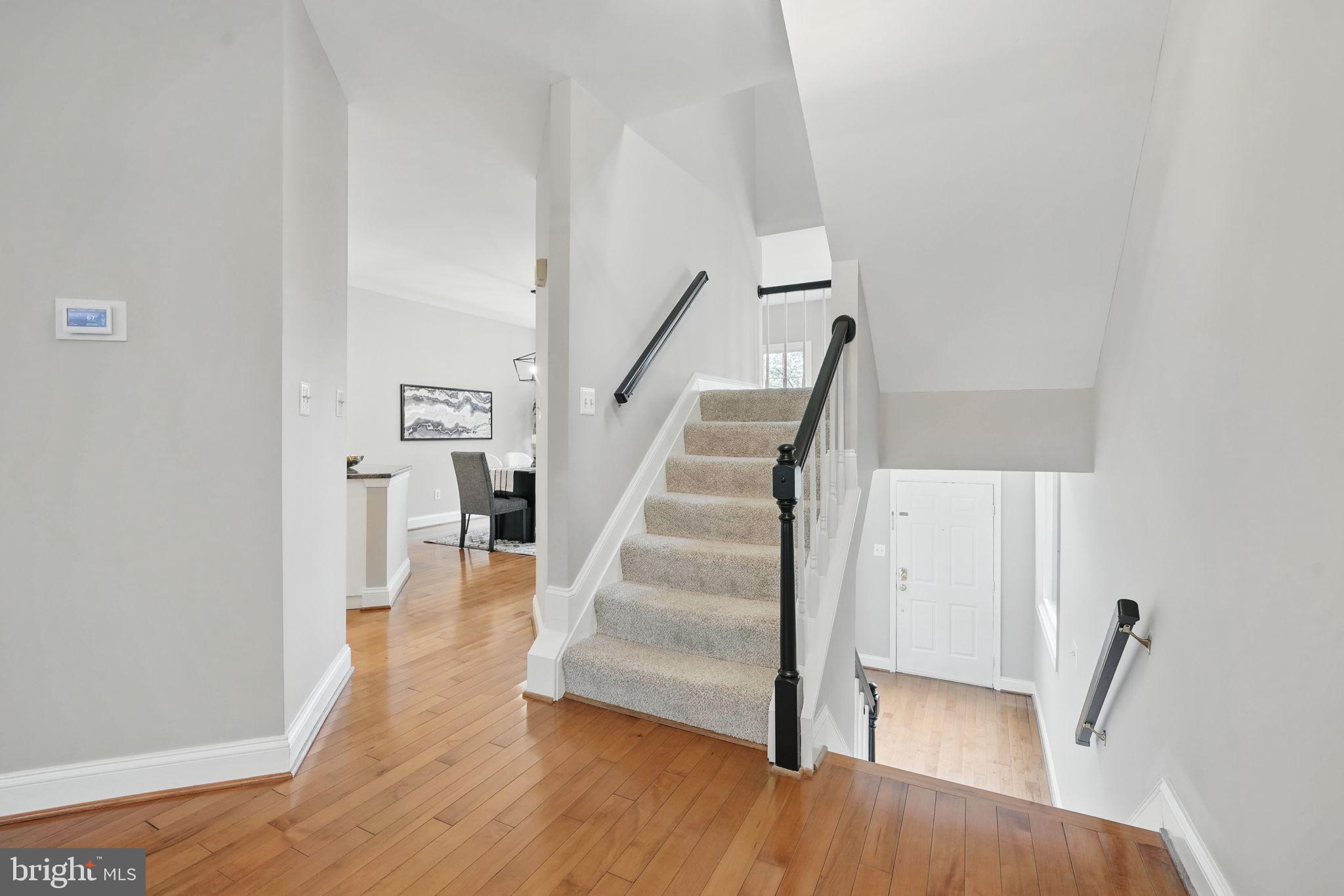 1393 Heritage Oak Way Reston, VA 20194 - Photo 4 of 80 a view of entryway with wooden floor