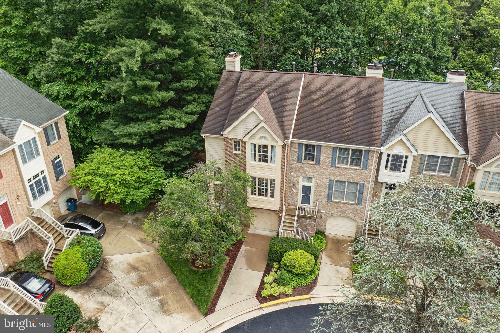 1393 Heritage Oak Way Reston, VA 20194 - Photo 43 of 80 an aerial view of a house with a yard and potted plants