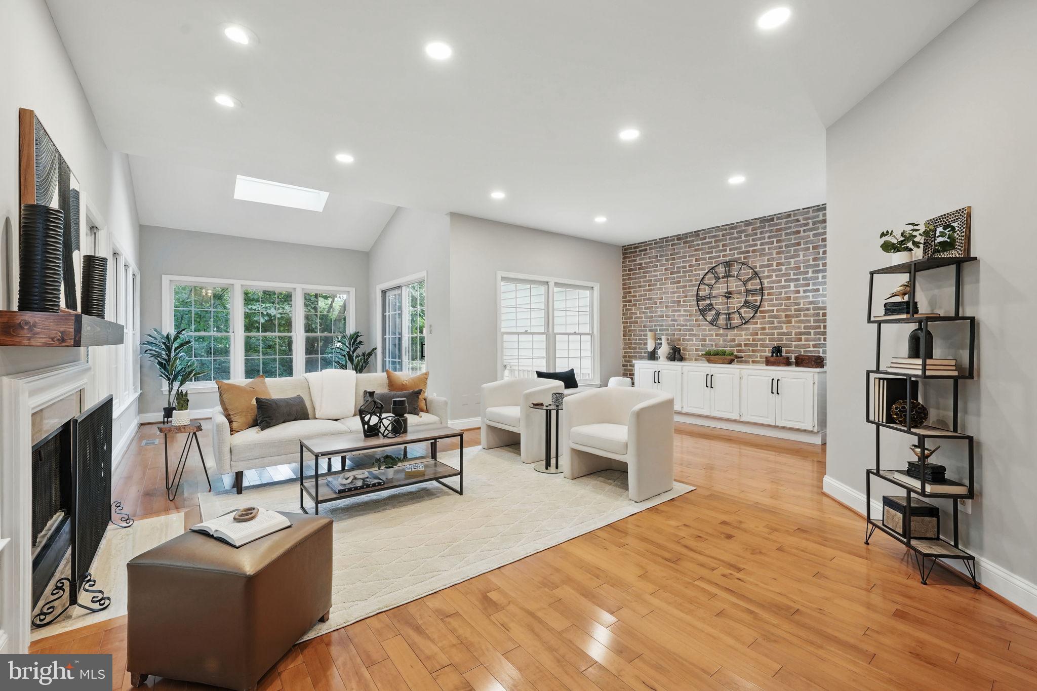 1393 Heritage Oak Way Reston, VA 20194 - Photo 5 of 80 a living room with furniture large window and a fireplace