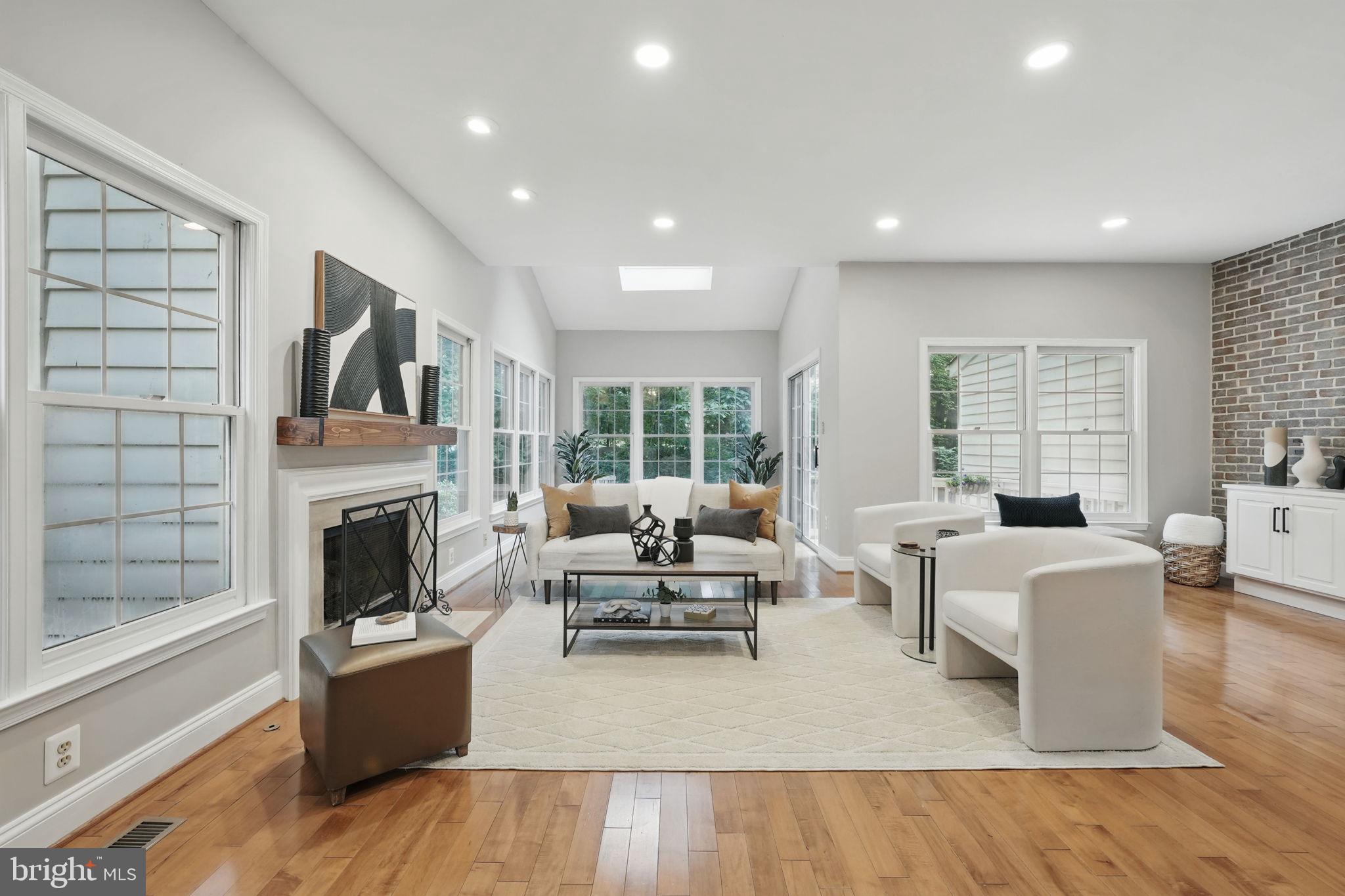 1393 Heritage Oak Way Reston, VA 20194 - Photo 7 of 80 a living room with furniture fireplace and flat screen tv