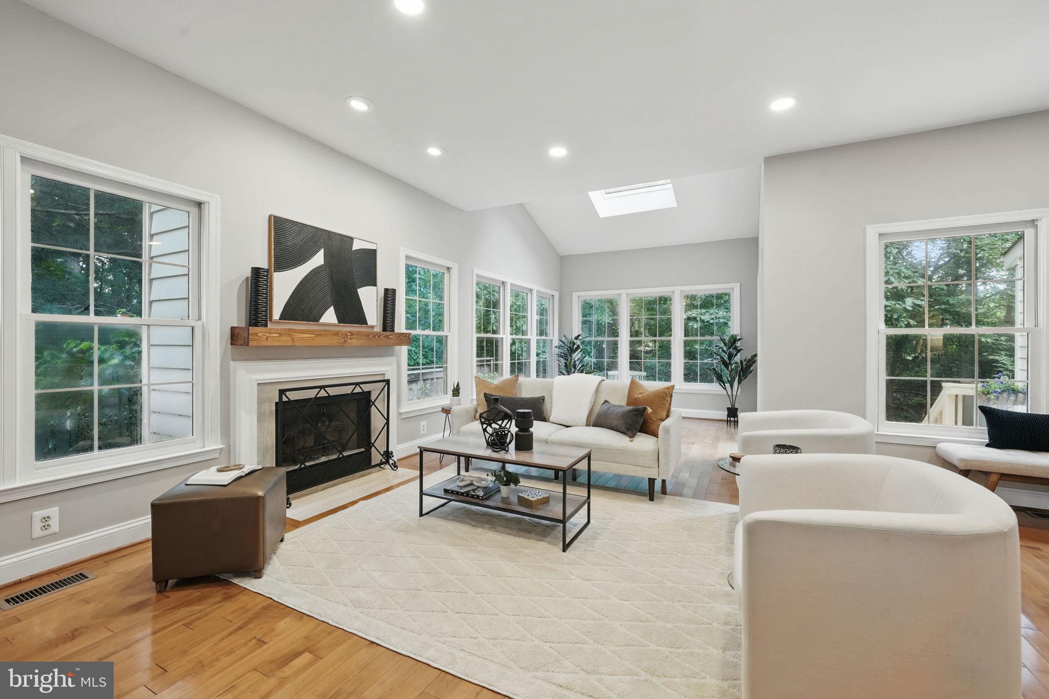 1393 Heritage Oak Way Reston, VA 20194 - Photo 8 of 80 a living room with furniture and a fireplace