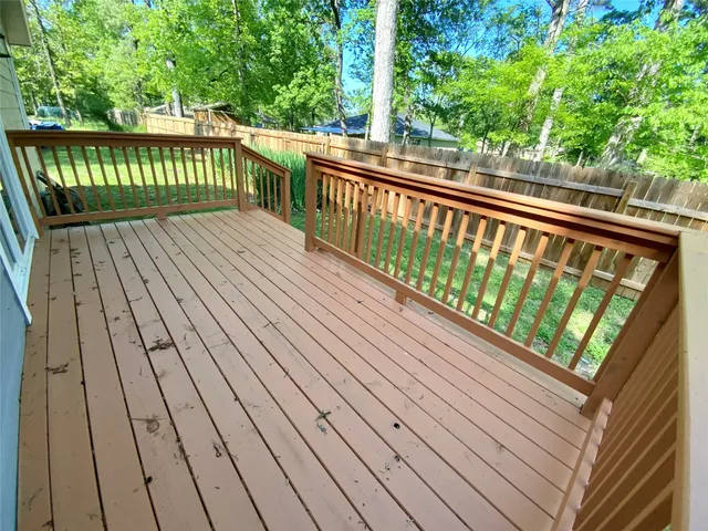 a balcony with trees in front of it
