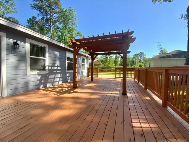 a view of a patio with wooden floor