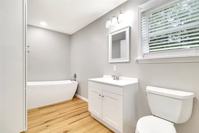 a bathroom with a toilet a sink and bathtub