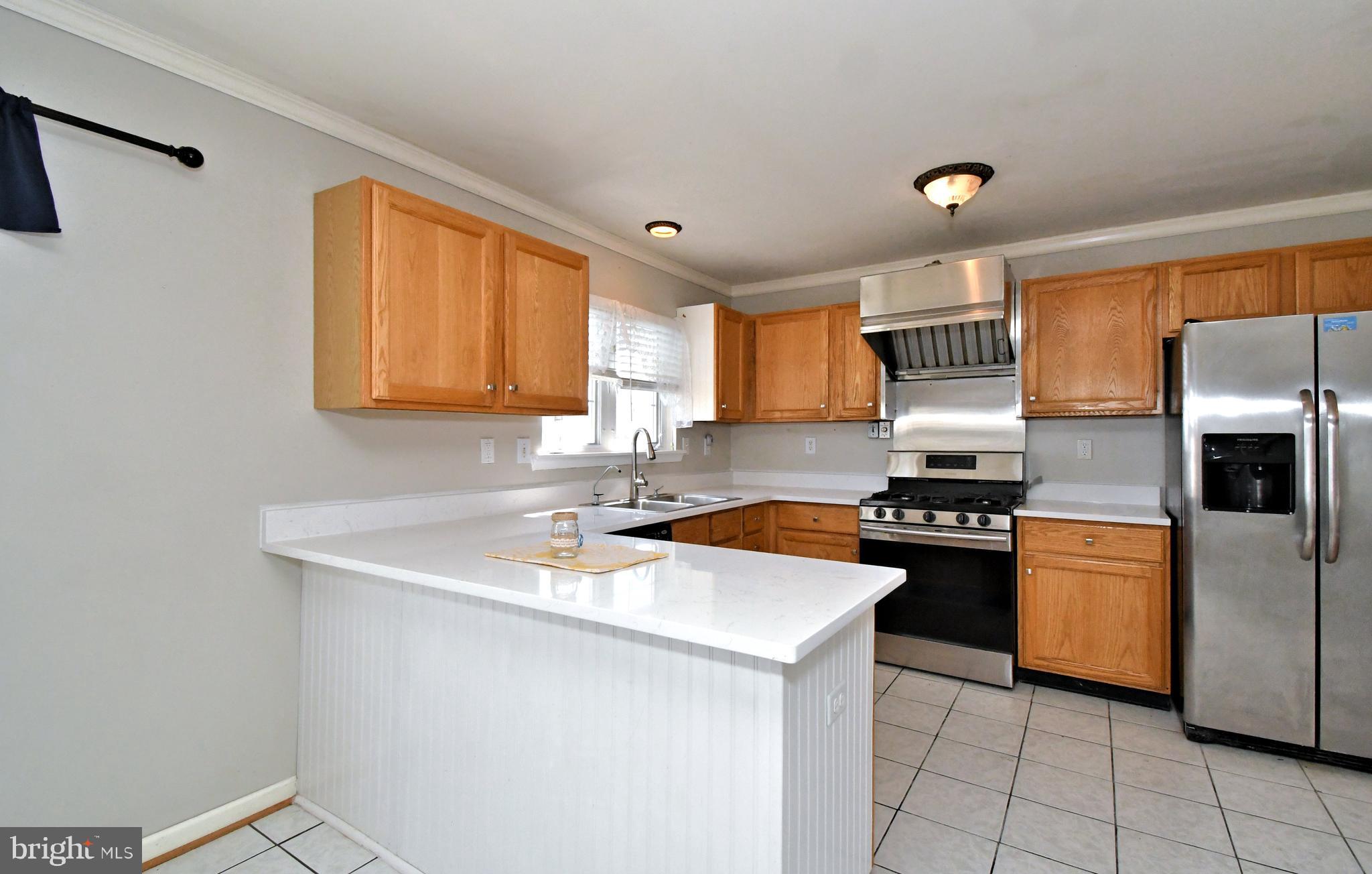 502 King Road Collegeville, PA 19426 - Photo 14 of 45 a kitchen with stainless steel appliances granite countertop a sink stove and refrigerator