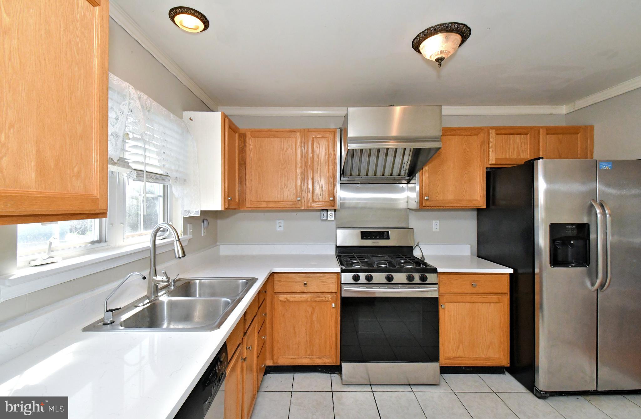 502 King Road Collegeville, PA 19426 - Photo 15 of 45 a kitchen with a sink a refrigerator and a stove