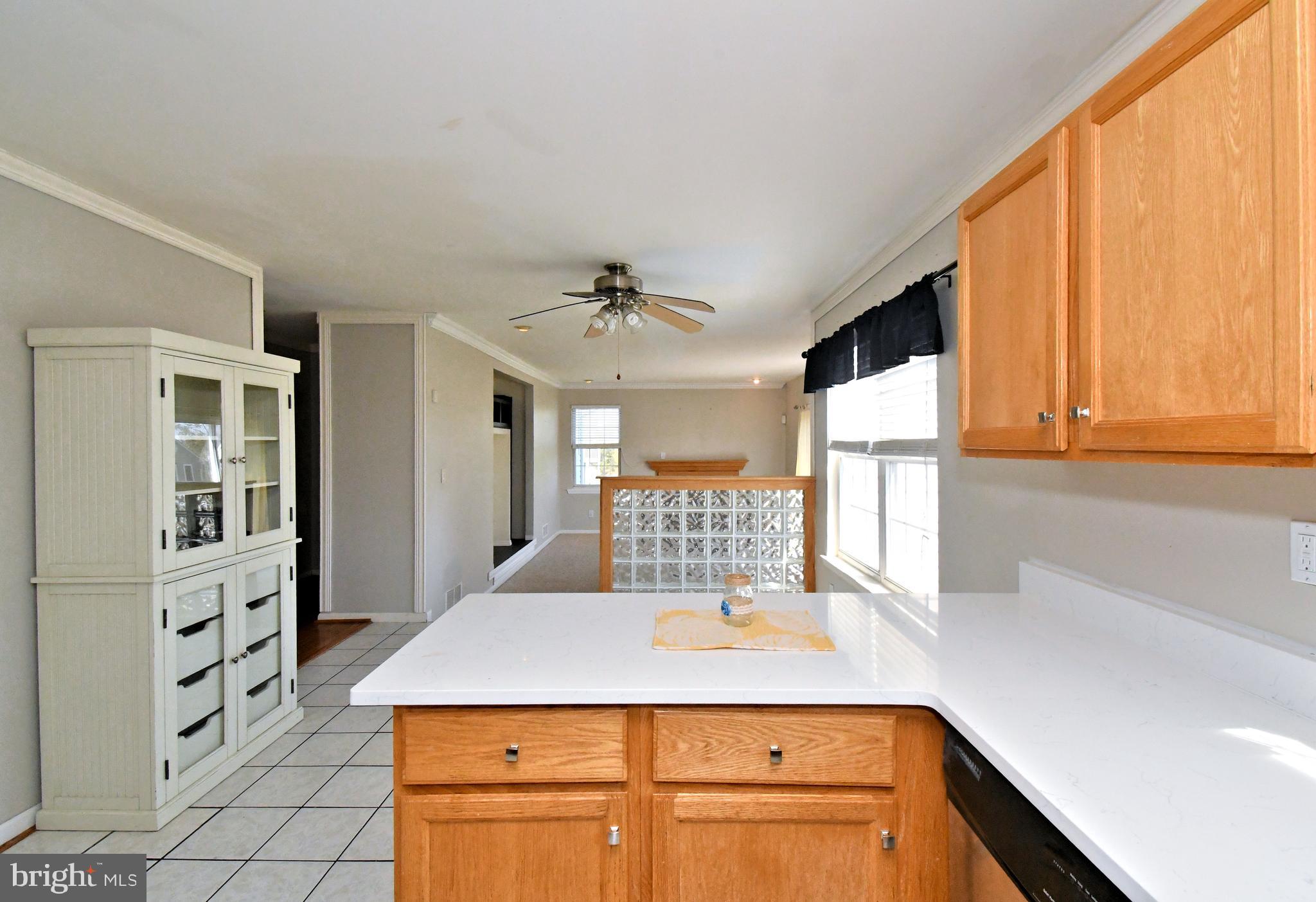 502 King Road Collegeville, PA 19426 - Photo 16 of 45 a kitchen with kitchen island a counter top space appliances and a large window