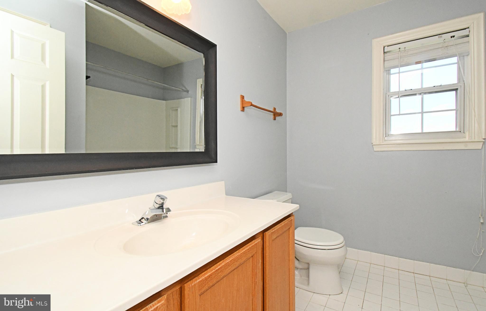 502 King Road Collegeville, PA 19426 - Photo 40 of 45 a bathroom with a sink a toilet and mirror