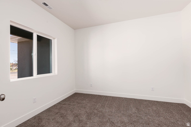 51 West 500 South Monroe, UT 84754 - Photo 6 of 41 Neutral-toned carpeting paired with white baseboards and walls