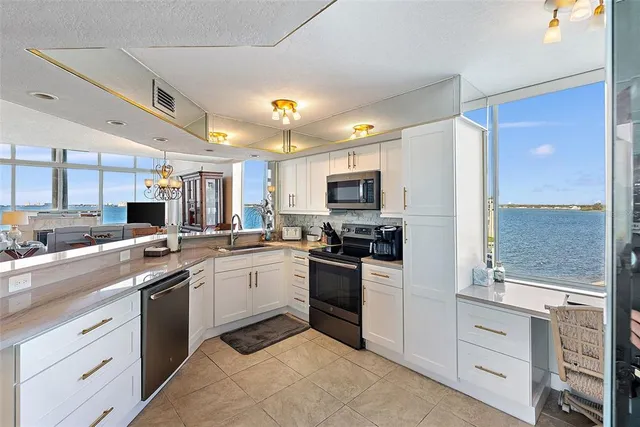 a kitchen with stove and cabinets