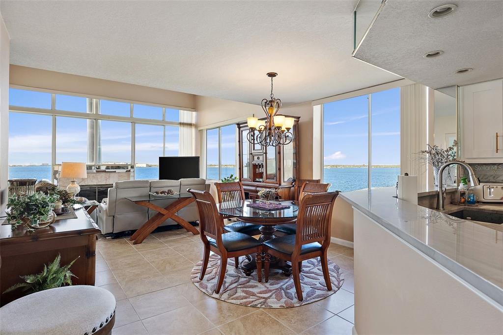 5279 Isla Key Boulevard South, Unit 417 St. Petersburg, FL 33715 - Photo 16 of 40 a view of a dining room with furniture window and outside view