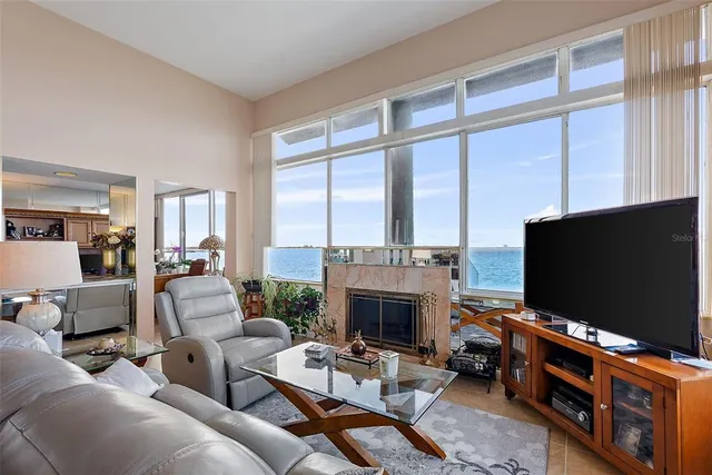 a kitchen with white cabinets and appliances