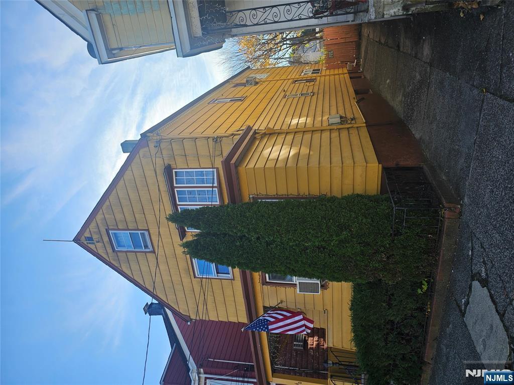 58-60 Murray Avenue Paterson, NJ 07501 - Photo 2 of 5 a view of a house with a yard