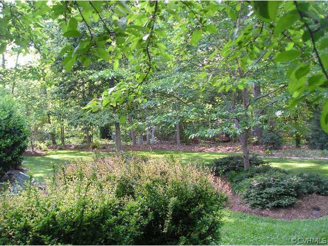 609 Rivers Bend Circle Chester, VA 23836 - Photo 3 of 8 a backyard of a house with a yard and outdoor seating