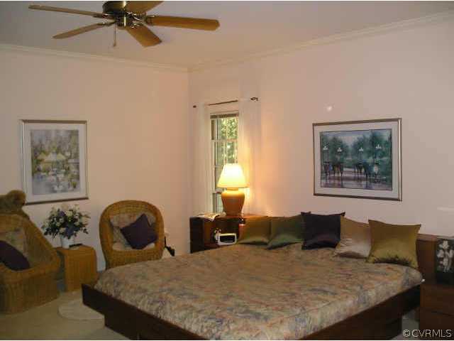 609 Rivers Bend Circle Chester, VA 23836 - Photo 7 of 8 a bed room with a bed and two couches