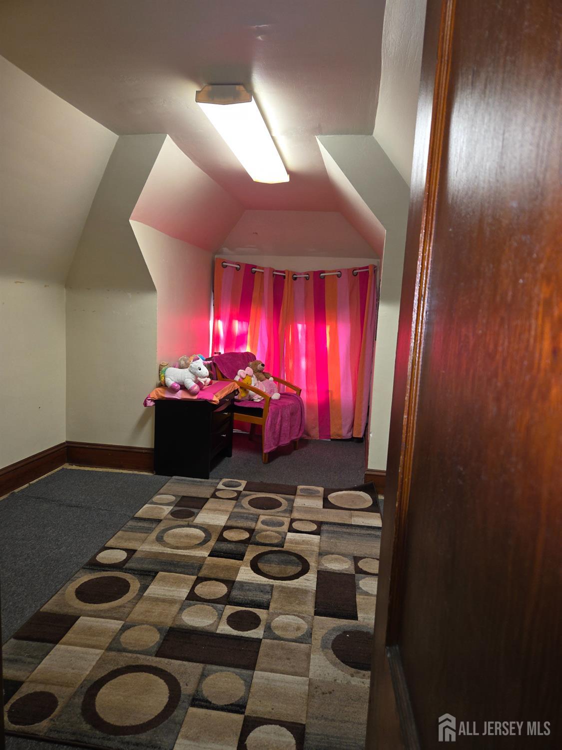 552 Compton Avenue Perth Amboy, NJ 08861 - Photo 13 of 13 a room with furniture and a fireplace