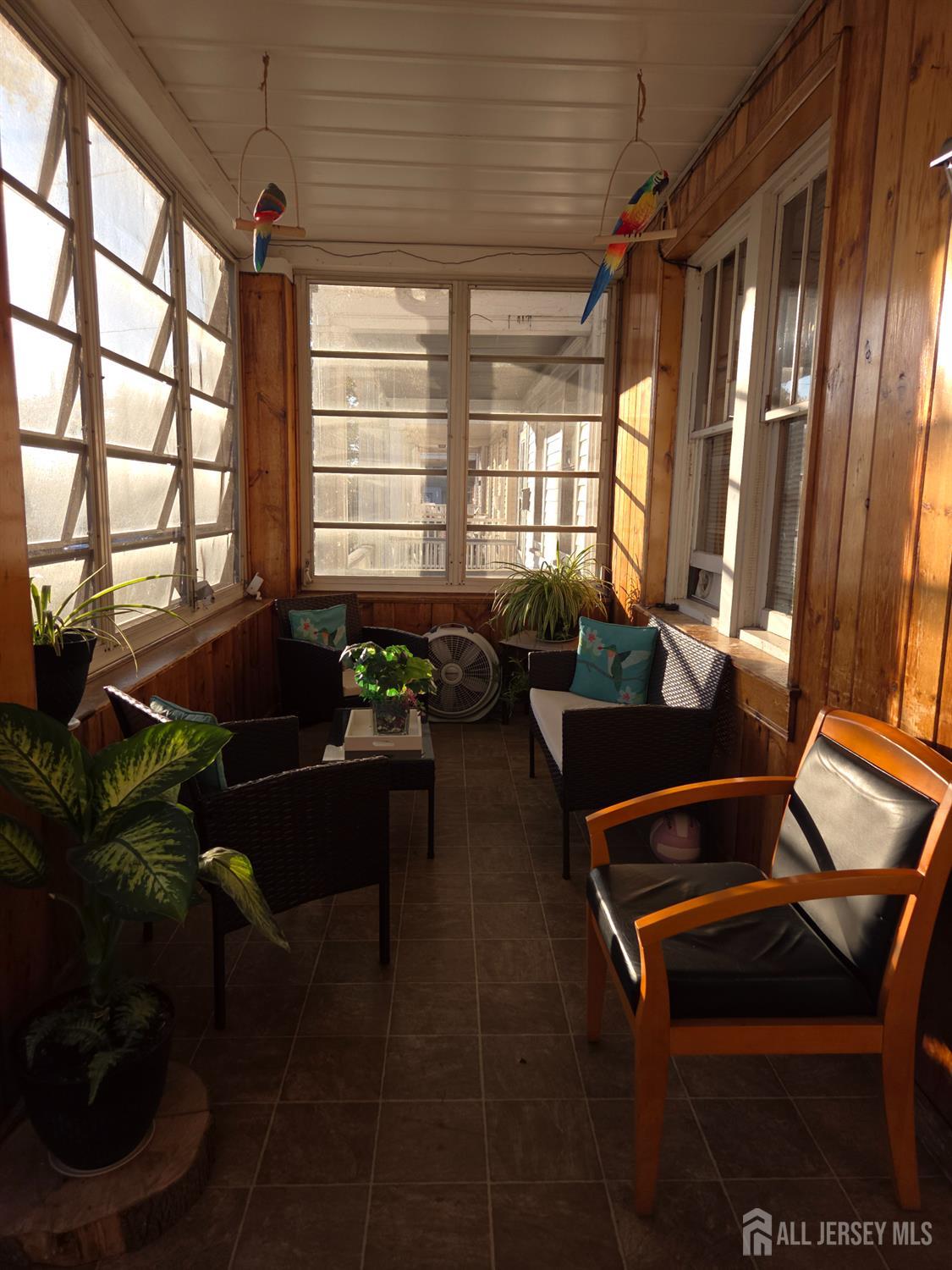 552 Compton Avenue Perth Amboy, NJ 08861 - Photo 2 of 13 a room with furniture and a window