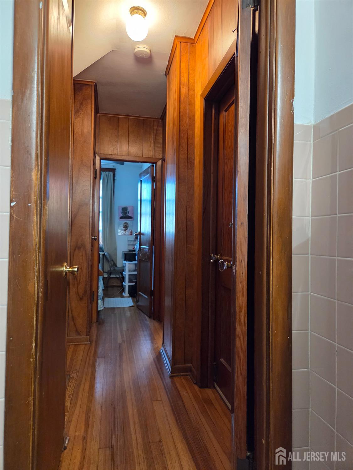552 Compton Avenue Perth Amboy, NJ 08861 - Photo 8 of 13 a view of a hallway with wooden floor