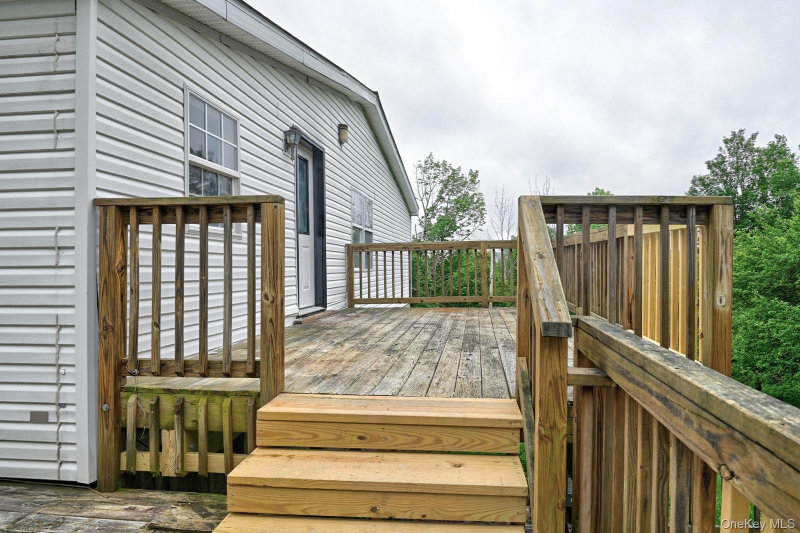 386 Airport Road Liberty, NY 12754 - Photo 15 of 21 a view of backyard with large trees and wooden fence