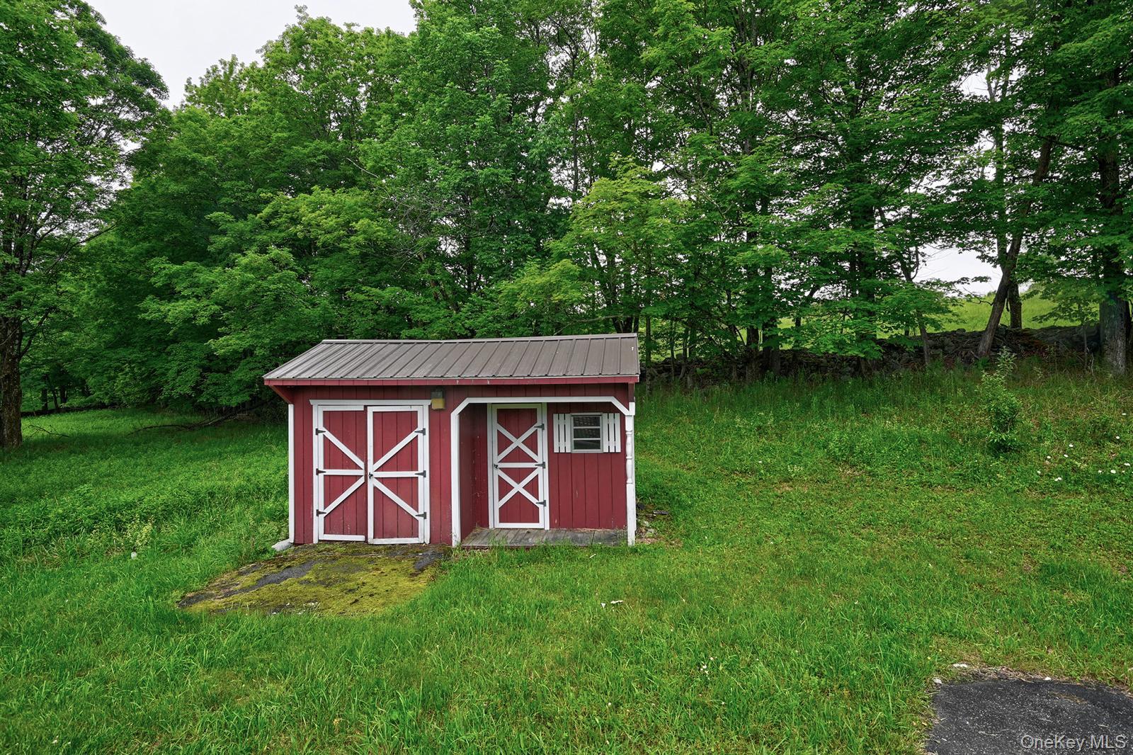 386 Airport Road Liberty, NY 12754 - Photo 17 of 21 a view of backyard of house with green space
