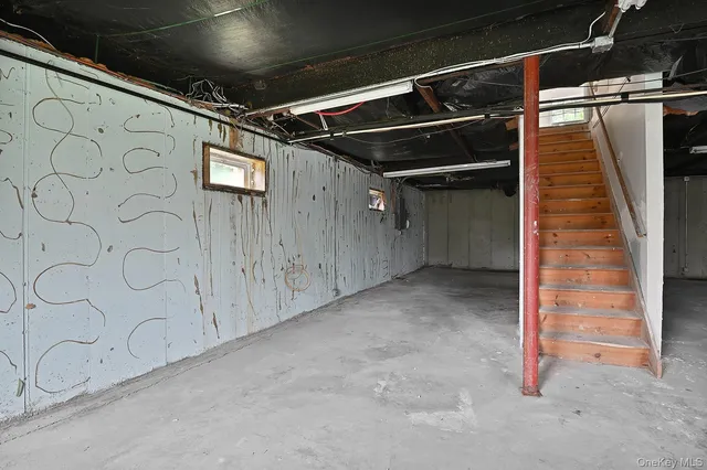 a view of an empty room with wooden walls